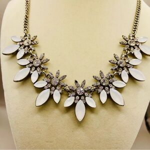 Vintage rhinestone floral statement necklace w/ white gemstone leaves. Romantic